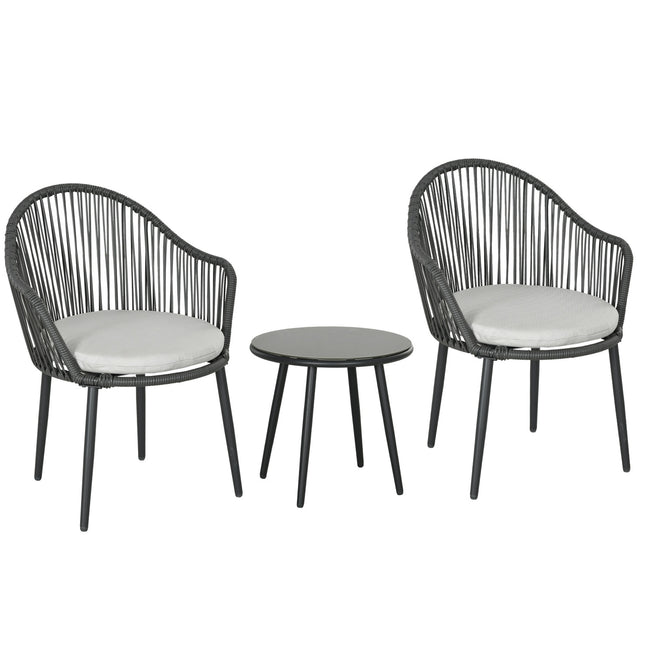 Rattan garden furniture - 2 chairs and table, cushions included