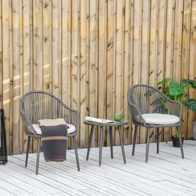 Rattan garden furniture - 2 chairs and table, cushions included