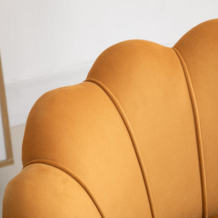 Upholstered shell-shaped armchair with metal legs, yellow