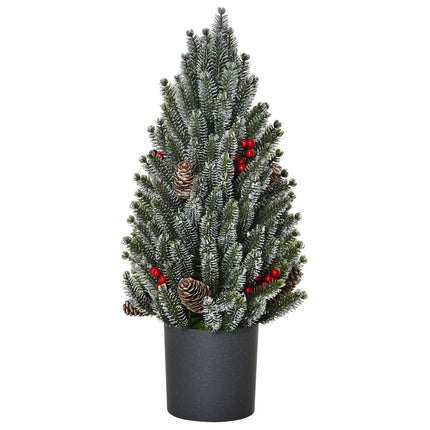 Snow-covered table Christmas tree with berries and pine cones