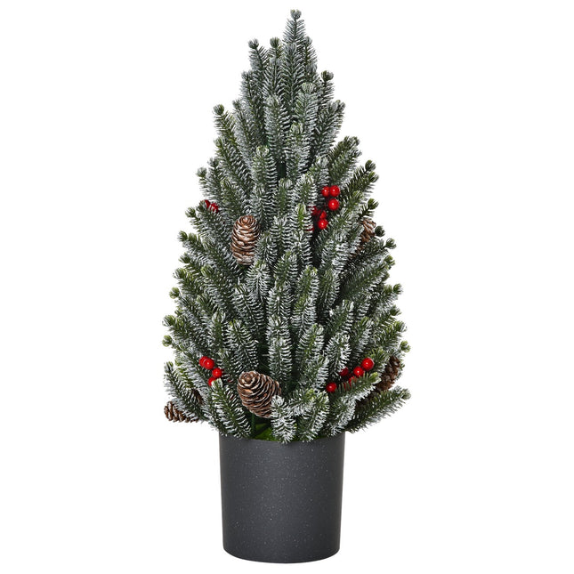 Snow-covered table Christmas tree with berries and pine cones