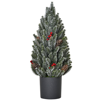 Snow-covered table Christmas tree with berries and pine cones