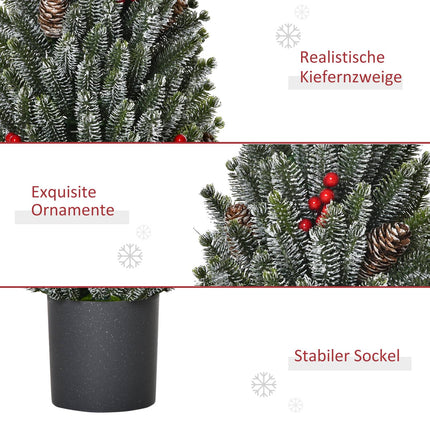Snow-covered table Christmas tree with berries and pine cones