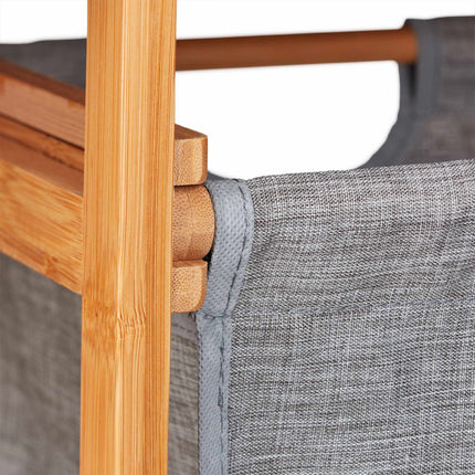 Bamboo bathroom shelf with laundry basket