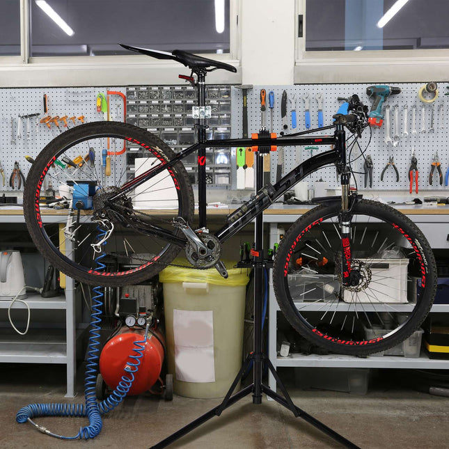 Bicycle mounting stand with handlebar holder