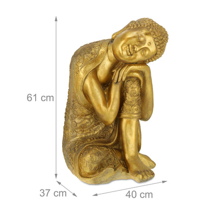 Buddha statue with head on knee