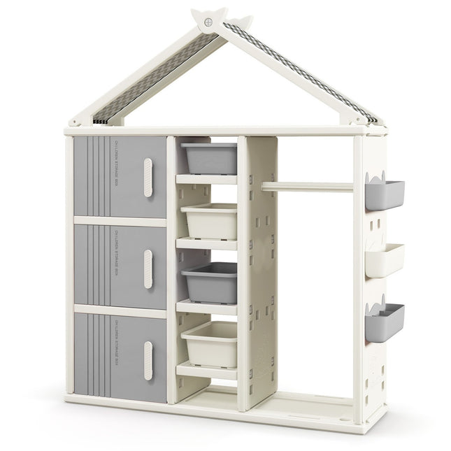 Kinderkast in de vorm van een huis met kledingstang