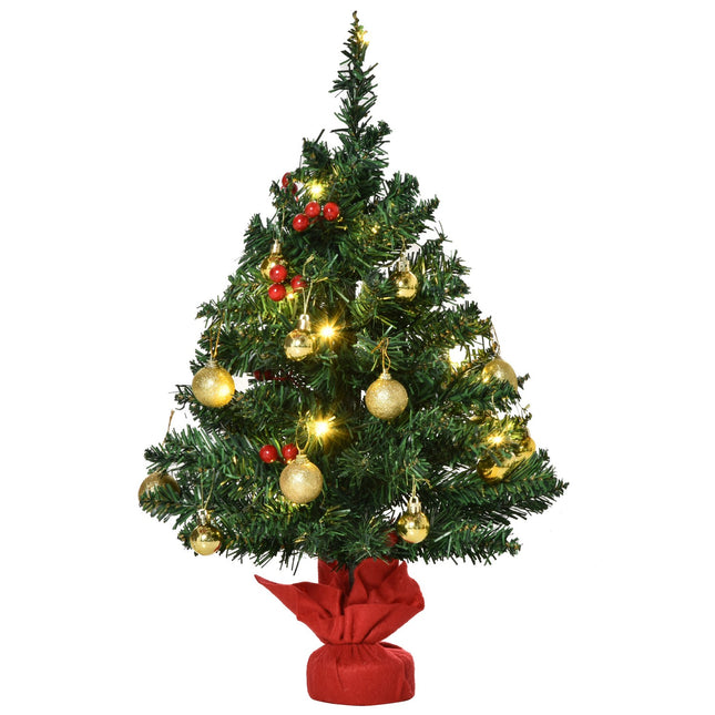 Small green Christmas tree with LED lights and berries