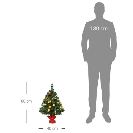 Small green Christmas tree with LED lights and berries