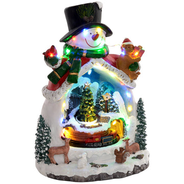 Christmas village with LED lights, music and trains