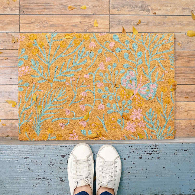 Coconut fiber doormat with a spring-like motif