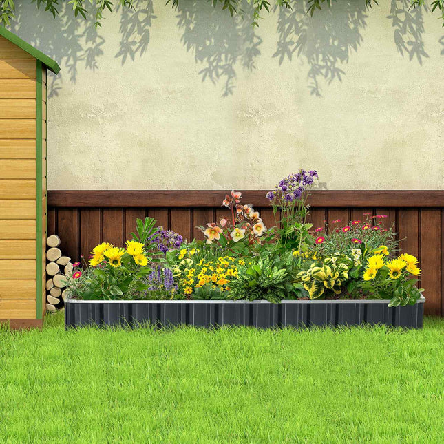 Steel raised garden bed with plant signs and gloves