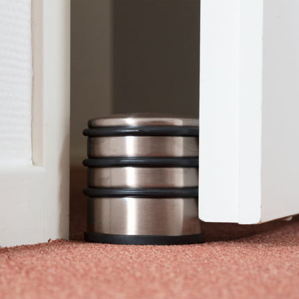 Door stop in stainless steel and bronze