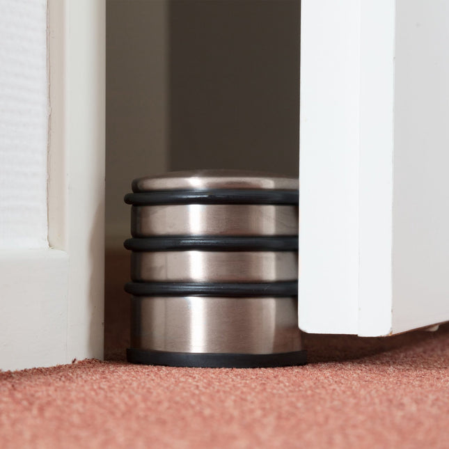 Door stop in stainless steel and bronze