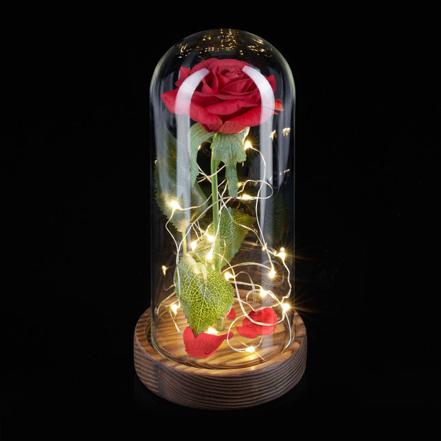 Eternal rose in glass with candle