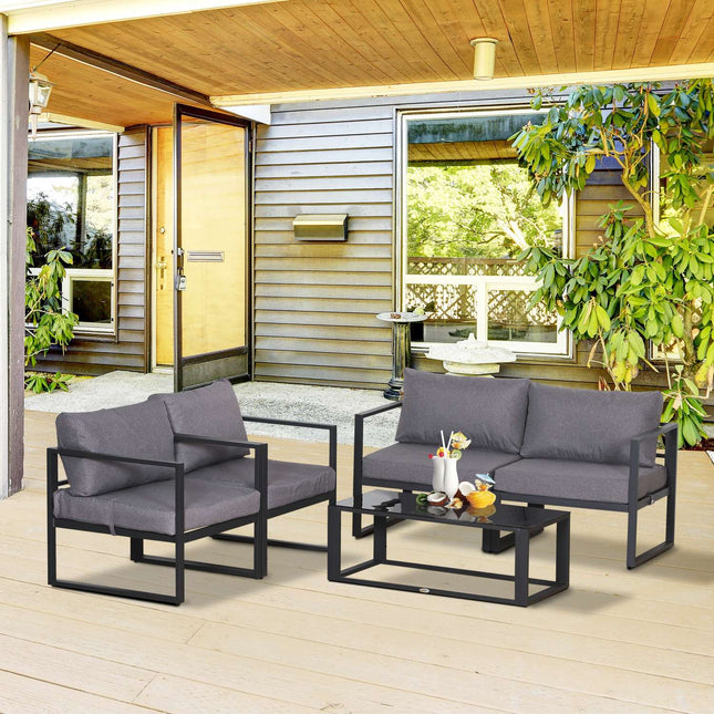 Four piece gray garden furniture set with cushions and storage