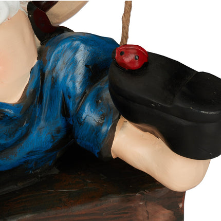 Garden gnome on a swing