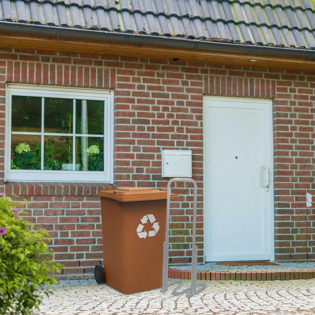 Grijze afvalpers voor de vuilnisbak