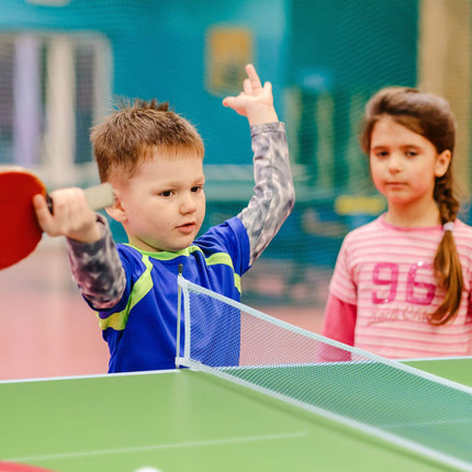 Green ping pong table with accessories