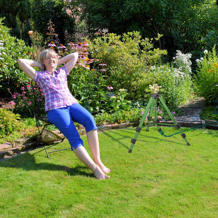 Green sprinkler with metal stand