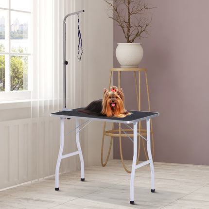 Adjustable dog grooming table with slings for bathing