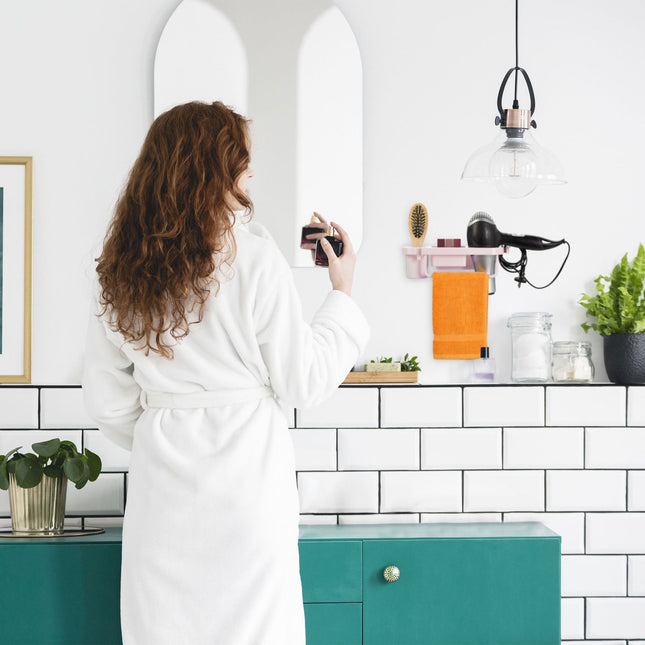 Hair dryer holder for the wall