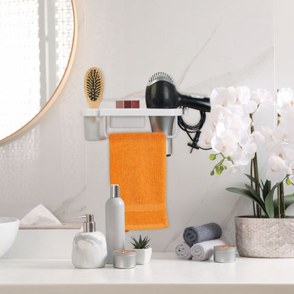 Hair dryer holder for the wall
