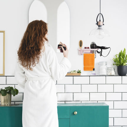 Hair dryer holder for the wall