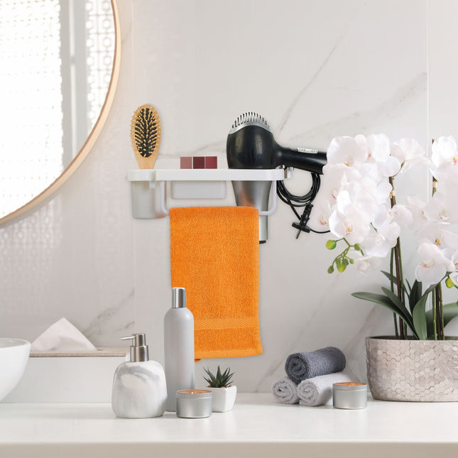 Hair dryer holder for the wall