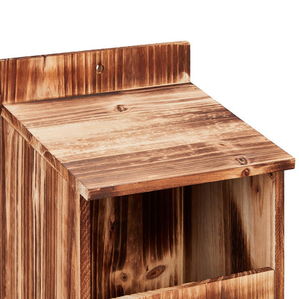 Nesting box for birds that nest in semi-cavities