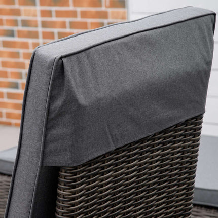 Adjustable sun lounger in poly rattan with table and cushion