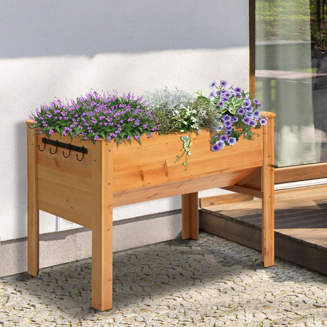 Raised wooden bed for herbs and flowers, with drainage and hooks