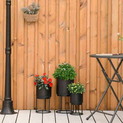 Set of 3 black stackable flower stands with pots