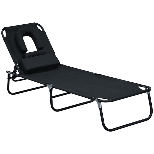 Black sun lounger with face opening for relaxation