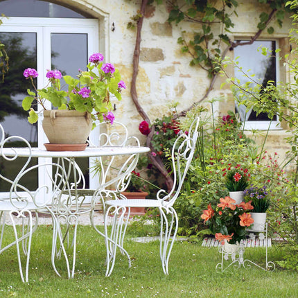 White flower pedestal in metal