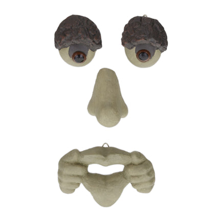 Wooden face with protruding tongue