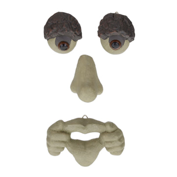 Wooden face with protruding tongue