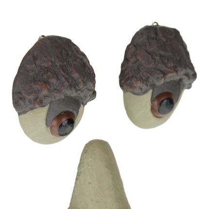 Wooden face with protruding tongue