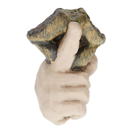 Wooden face with resting gesture
