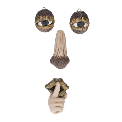 Wooden face with resting gesture