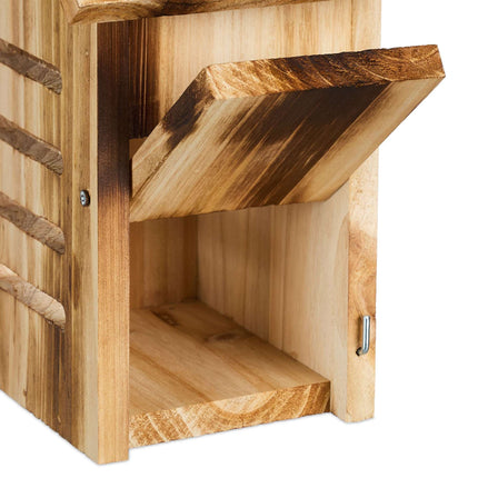 Wooden ladybug house with flames