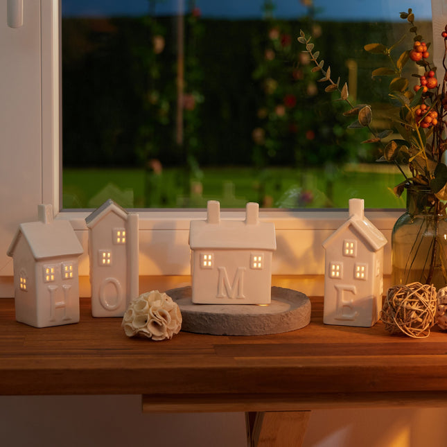 set of 4 ceramic "Home" heat candle holders